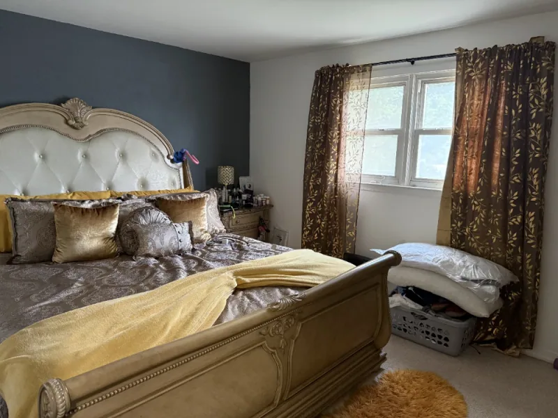 Bedroom refreshed with the bed made and linens smoothed
