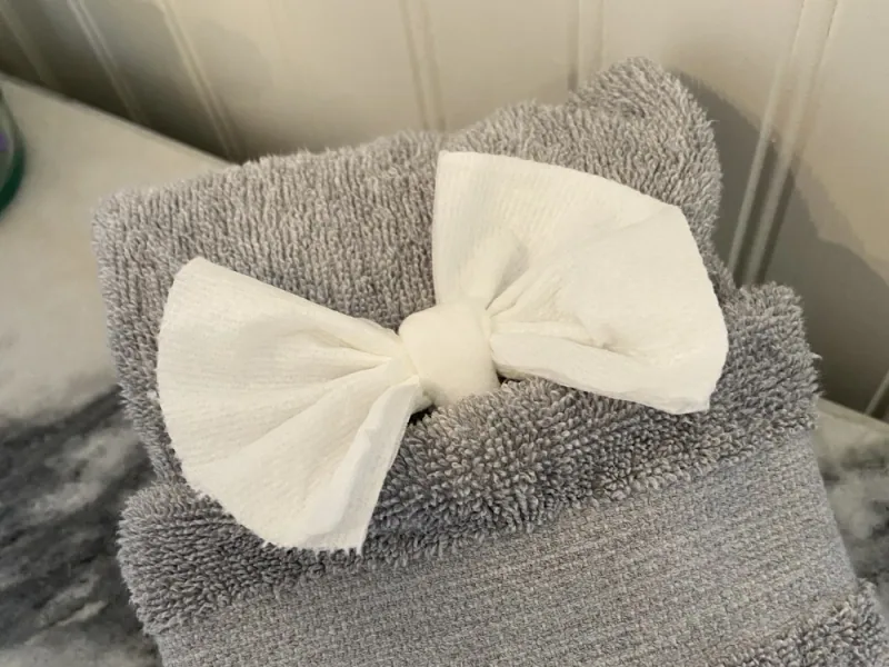Towels folded and finished with a bow — Super Clean’s signature touch